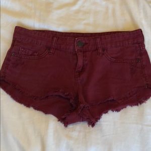BDG burgundy low rise dolphin shorts